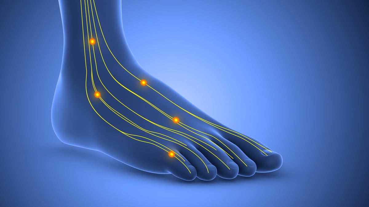 This stock image shows the sensation of tingling in the foot, an early sign of potential nerve damage.